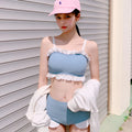 Women's conservative one-piece swimsuit with adjustable suspenders in solid colour