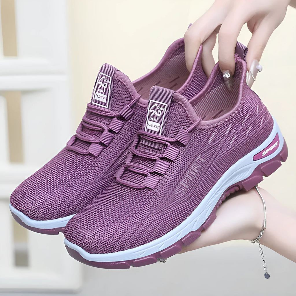 Casual low-top sneaker with soft PVC sole in men's black and women's light purple colour options.