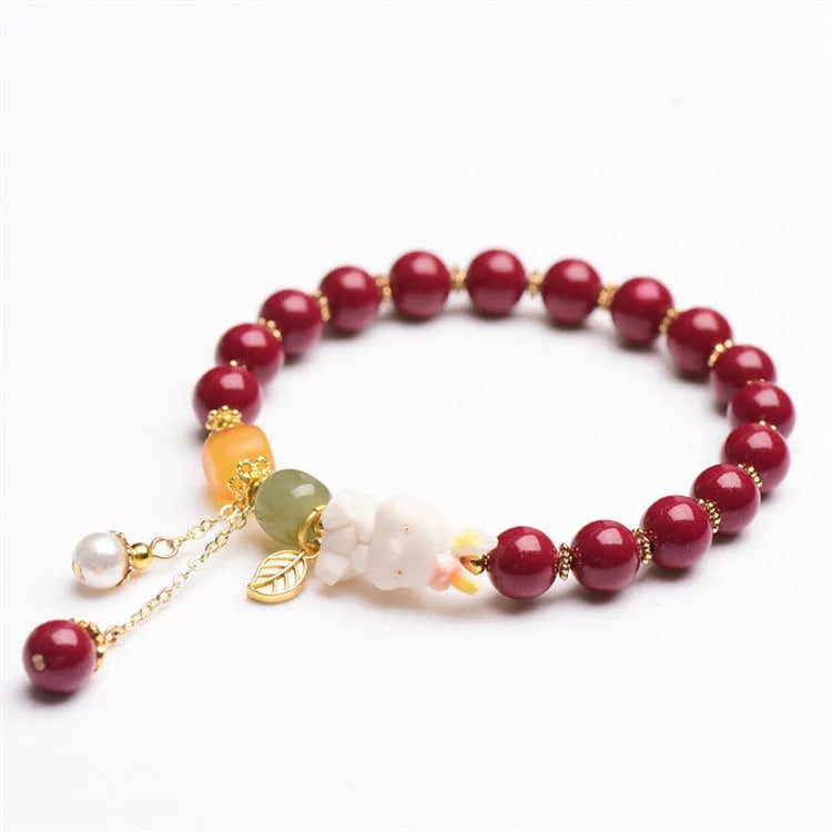 Natural cinnabar bracelet with rabbit design in purple gold sand colour, showing 8mm and 10mm bead size options.