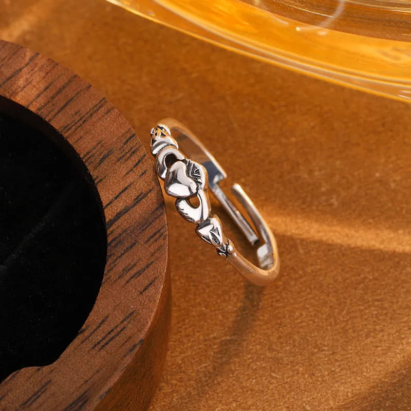 Women's copper heart open ring with retro silver finish showing adjustable back design
