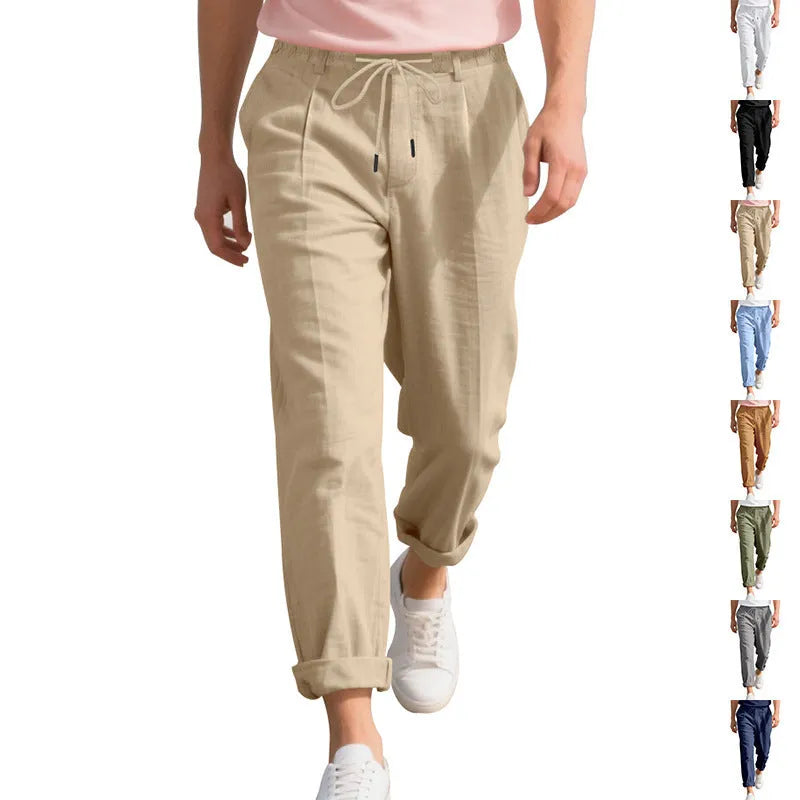 Men's light khaki linen trousers with a drawstring waist and straight leg on a hanger.