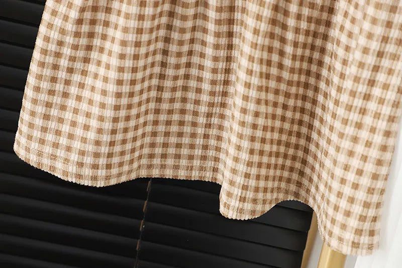 Baby girl wearing a dark coffee plaid Korean style long-sleeved dress suit with shirt.