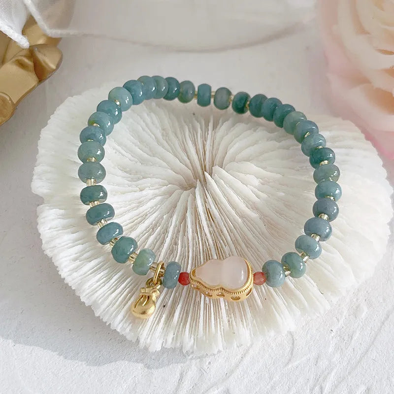 Jade bracelet with gourd pendant and peace buckle charms in natural blue water jade