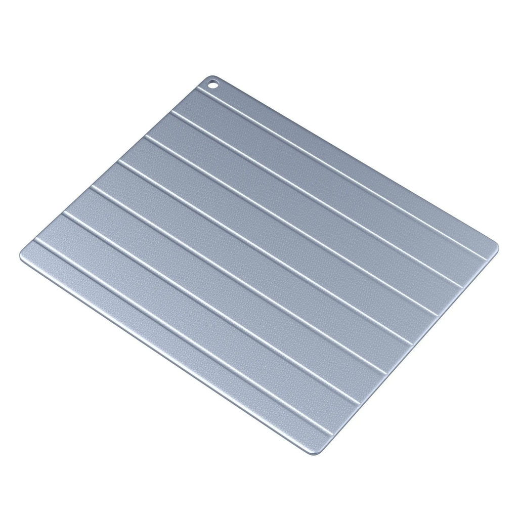Aluminium quick defrosting board in modern simplicity style on a kitchen counter
