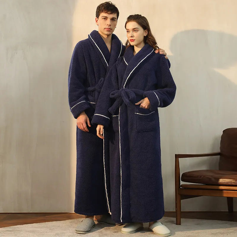 Man and woman wearing matching thick navy blue flannel bathrobes, showcasing the couple's winter loungewear.
