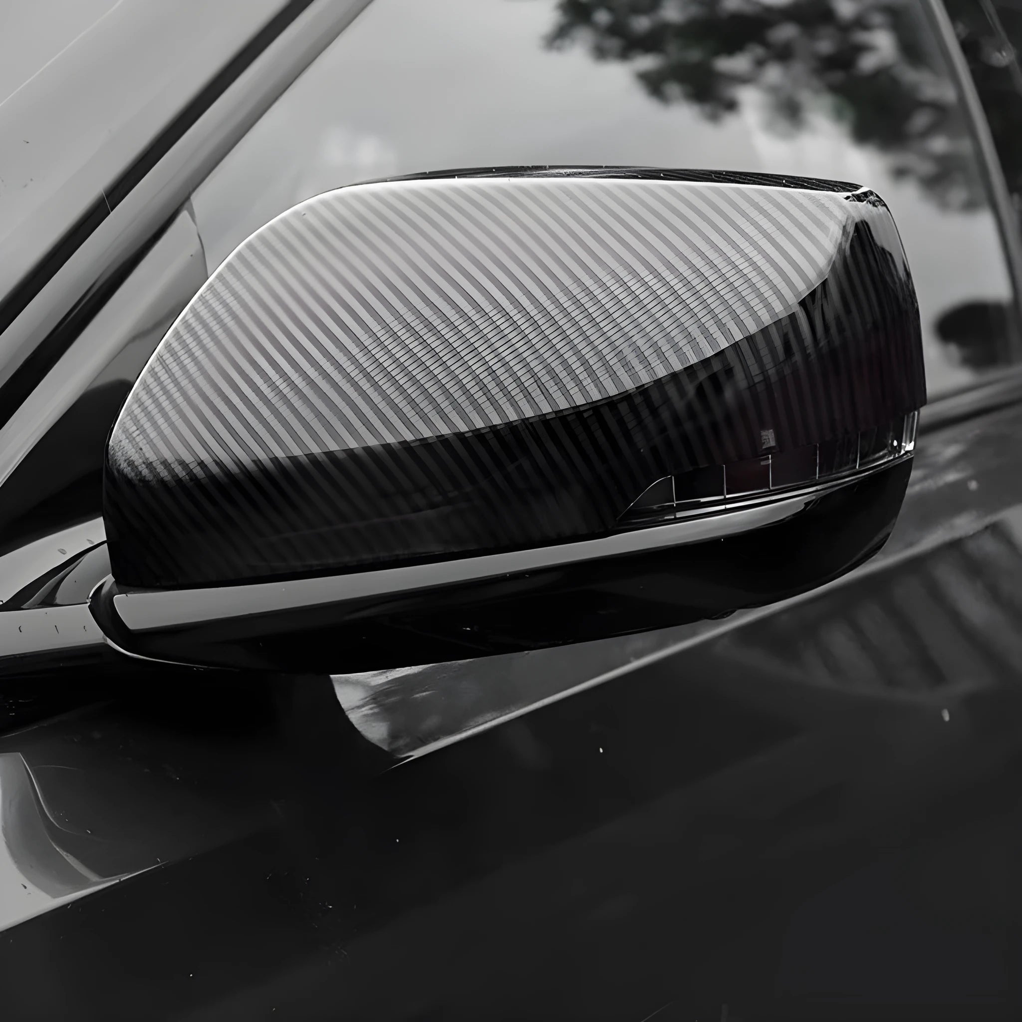 Pair of black ABS rearview mirror covers with carbon fibre pattern for Cadillac CT5 CT6.