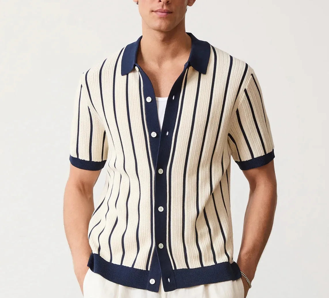 Men's white asymmetric lapel knit top with short sleeves on a model.
