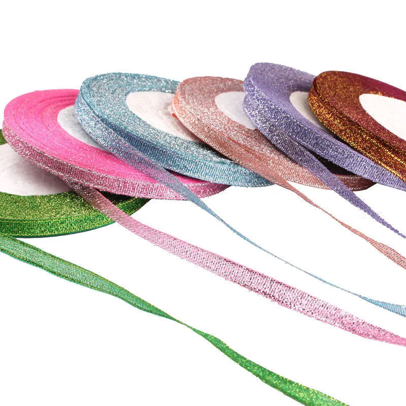 Roll of 0.6cm wide decorative polyester ribbon in a choice of 21 colours including metallic options.
