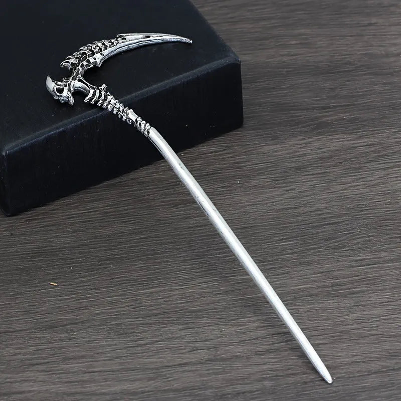Geometric retro skull sickle hairpin in ancient silver electroplated finish on neutral background