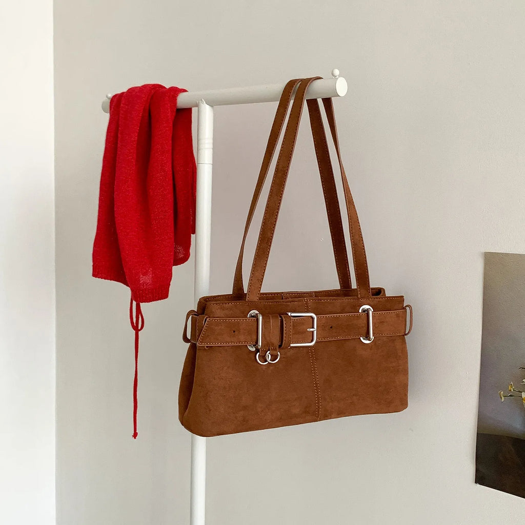 Retro minority design underarm bag in apricot colour with horizontal square shape and double shoulder straps.