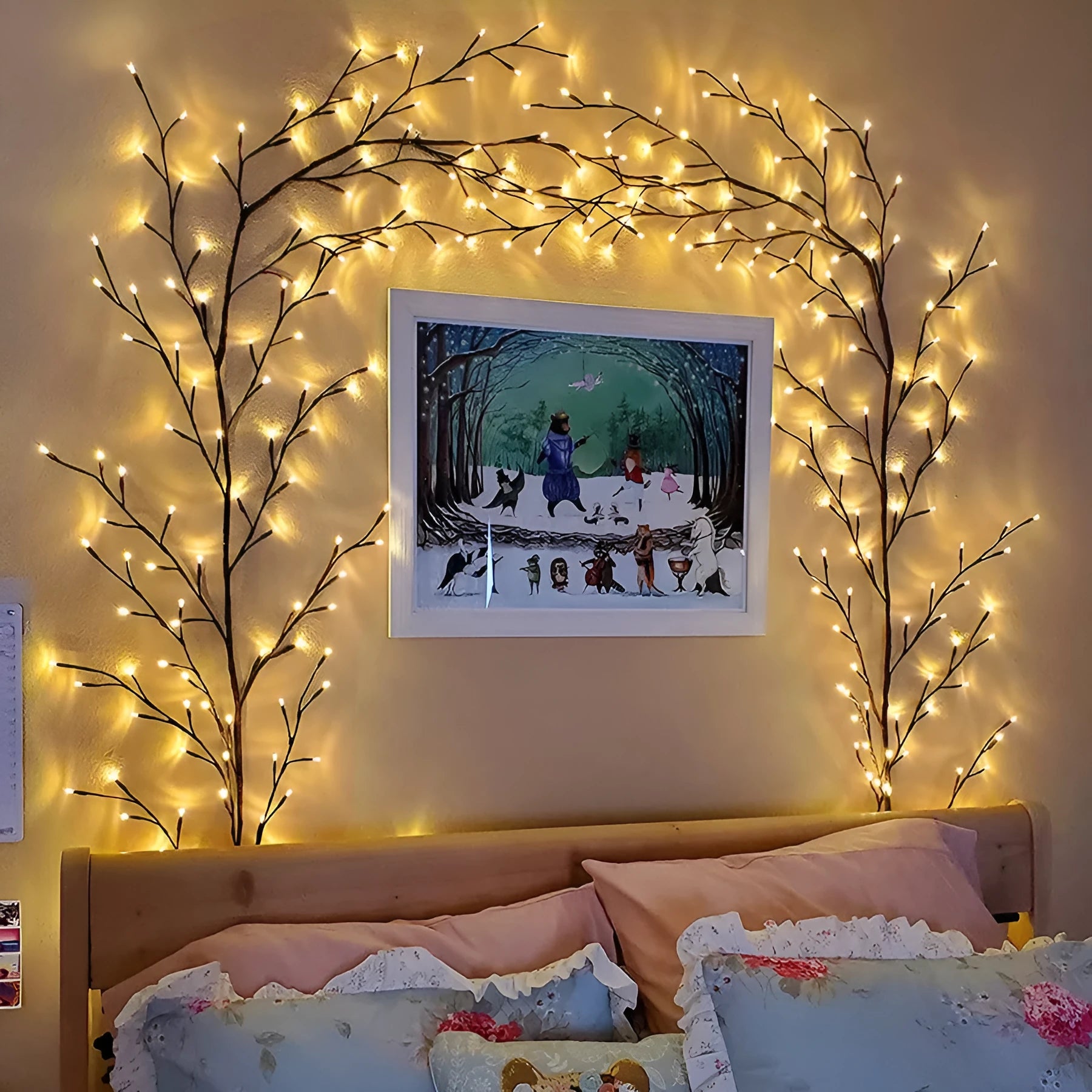 Flexible willow vine Christmas garland with birch bark texture and warm white LED lights extended along wall