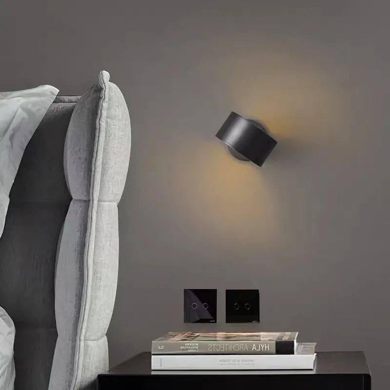 Modern simple copper wall lamp shown in gold and black finishes for living room use.