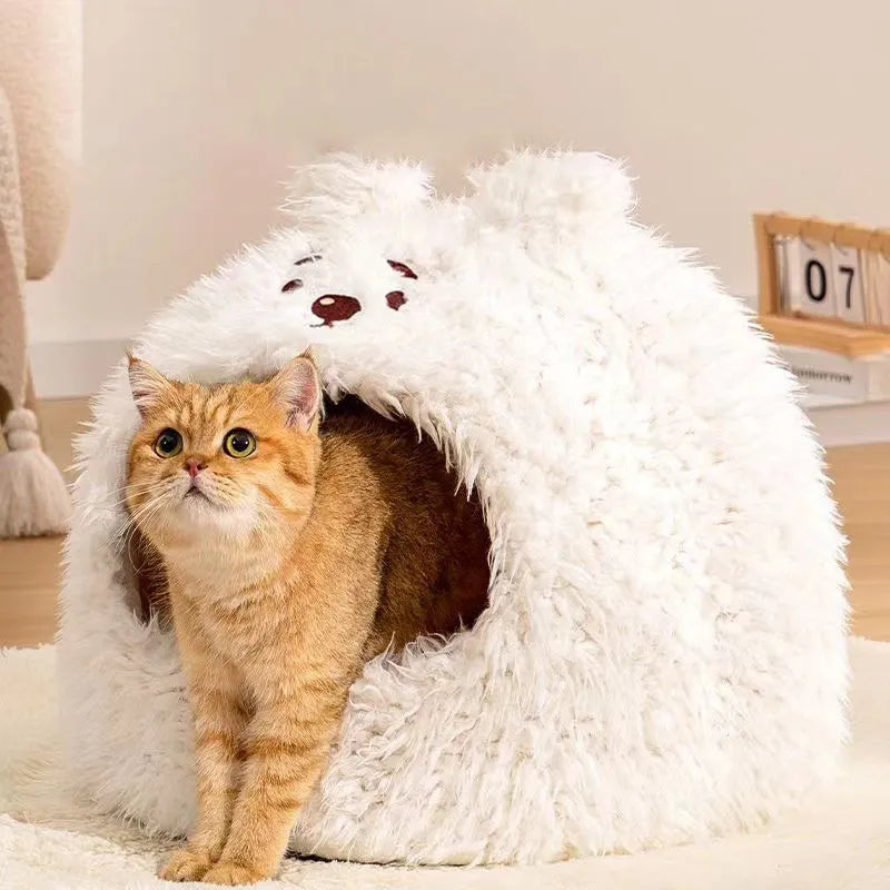 Semi-enclosed yurt-style cat litter tent in an animal print, shown next to a litter tray.