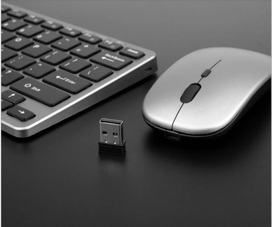 Silver wireless keyboard and mouse set with 78-key compact layout and USB charging cable