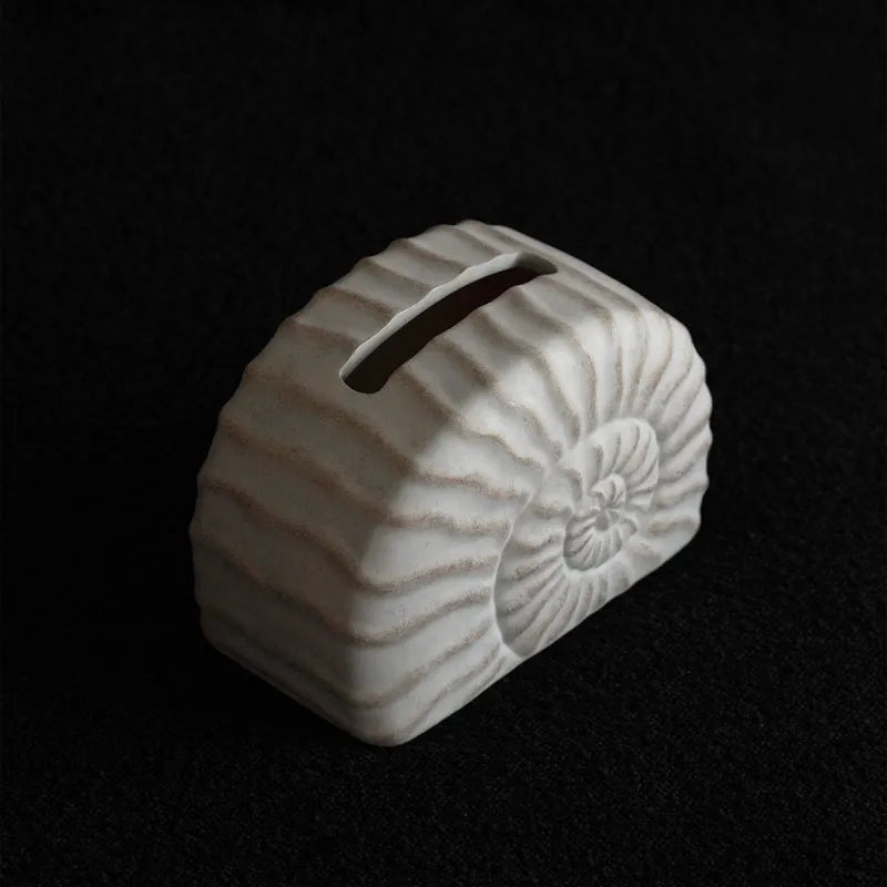 White resin tissue box cover with raised conch shell design