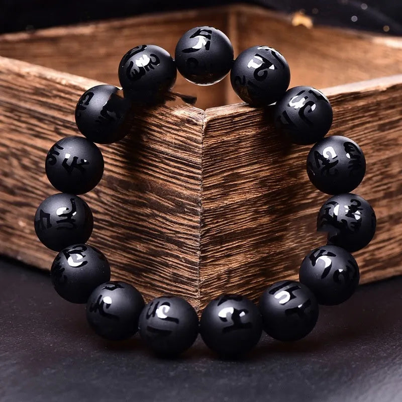 Natural frosted black agate Sanskrit mantra bracelet with Chinese auspicious patterns on beads.