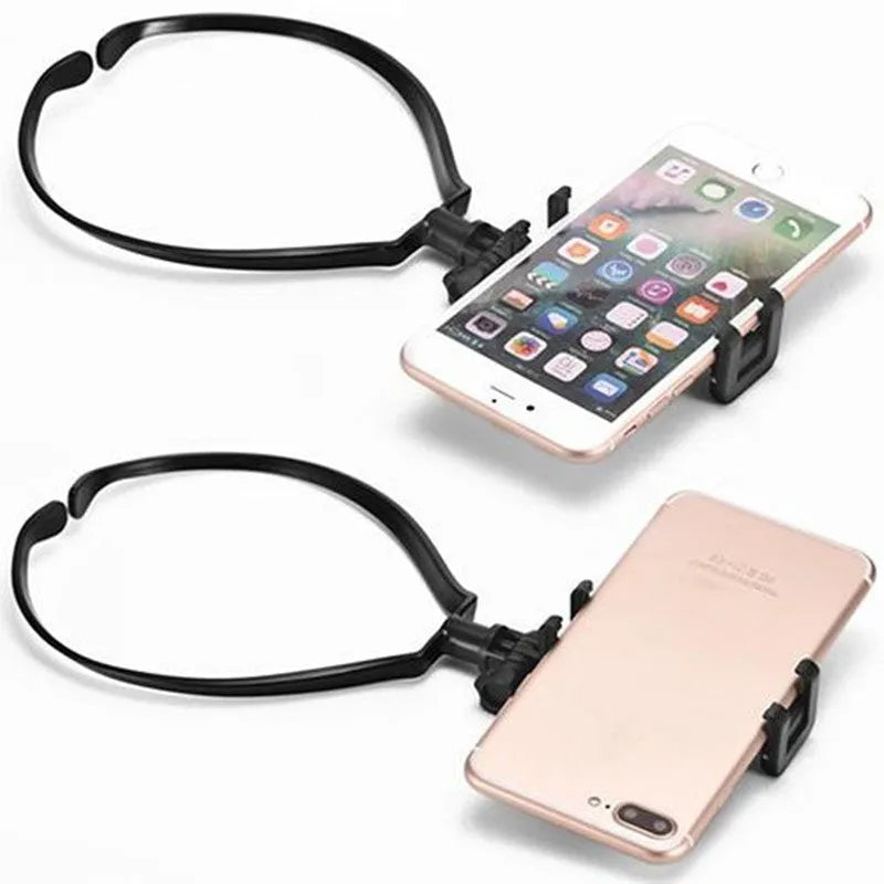 Black adjustable neck phone holder for smartphone, shown being worn for hands-free filming.