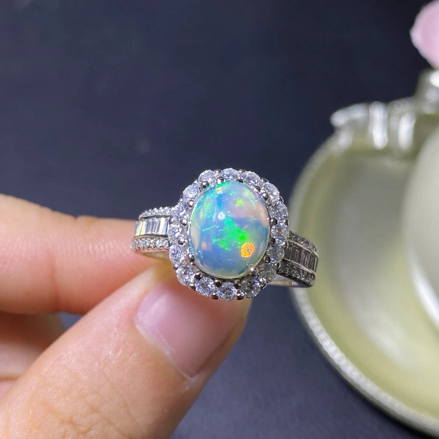 Handmade women's silver opal ring with an opening design, shown in a choice of colour plating.