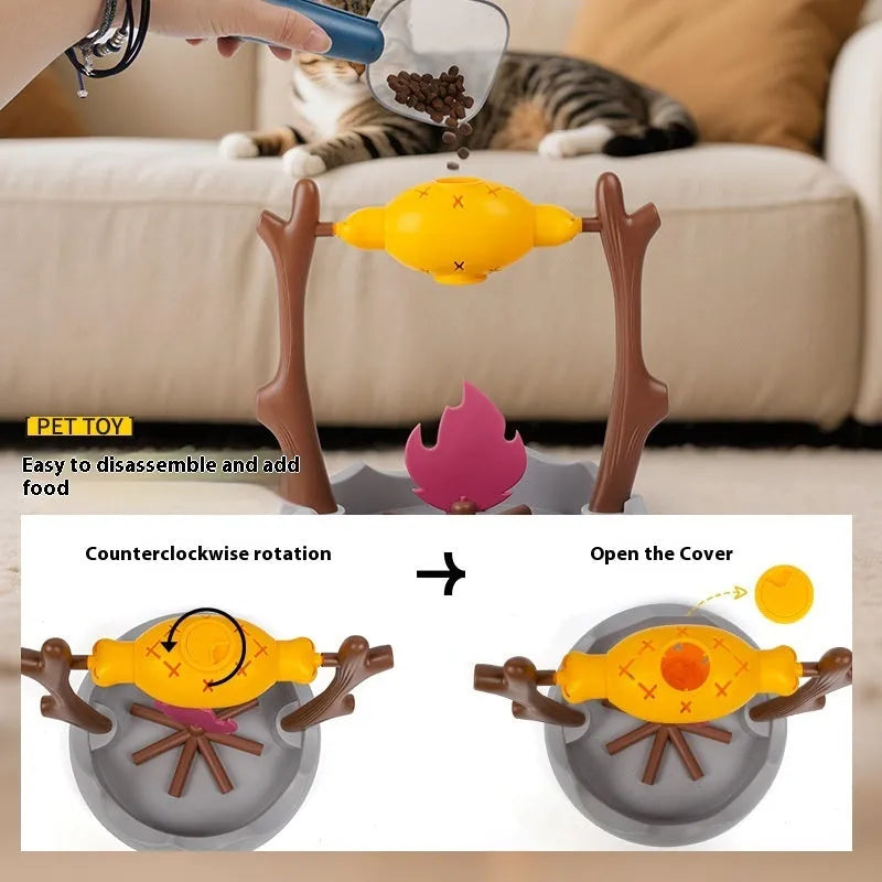 Barbecue-style rolling cat feeder toy with treat compartments, measuring 30cm cubed on a floor.