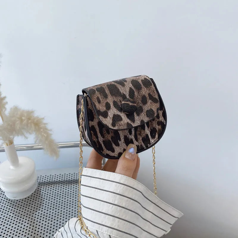 Leopard print mini crossbody saddle bag in PU, horizontal square shape with sandwich pocket, black and reddish brown