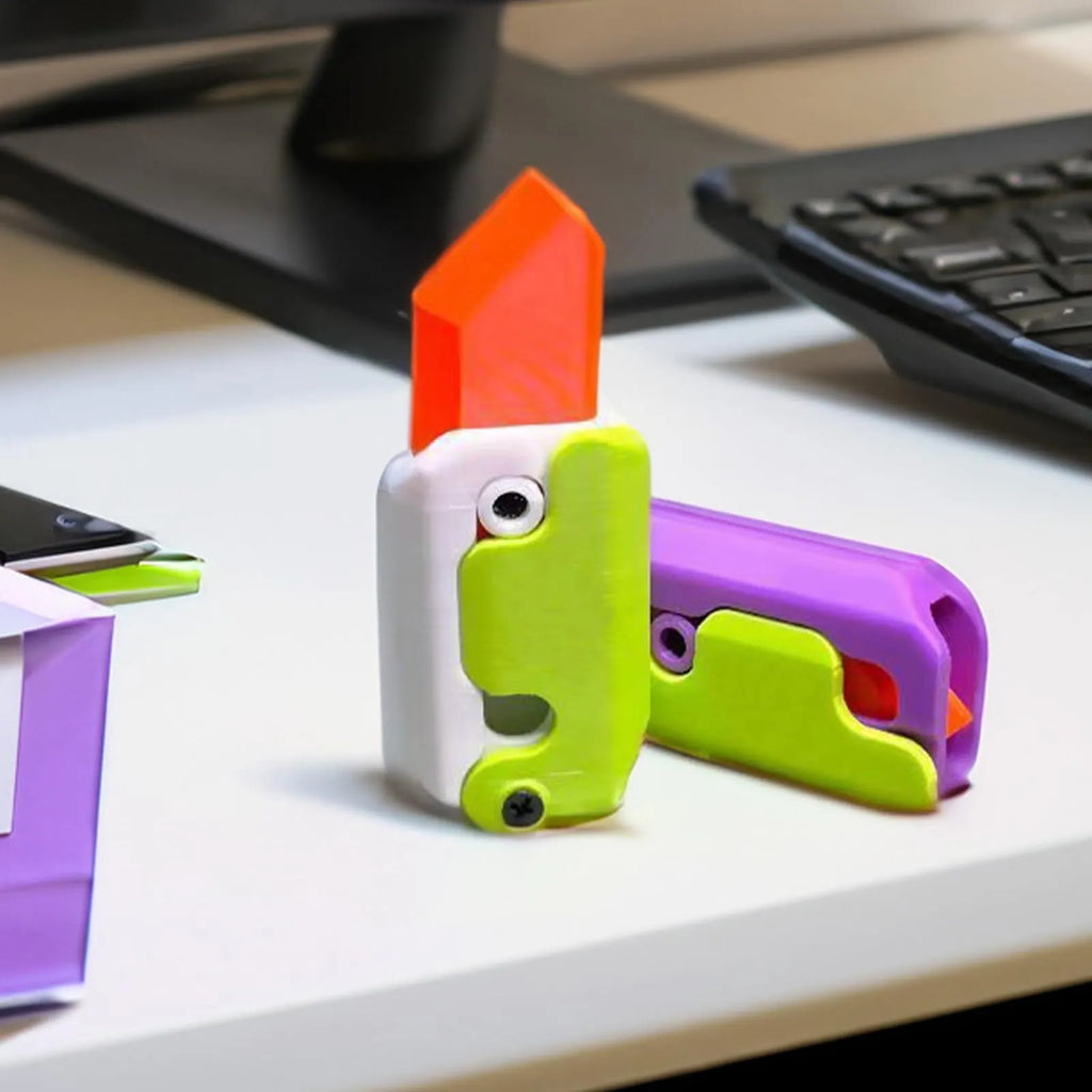 3D printed plastic gravity carrot knife fidget toy in orange, purple, and green colours.