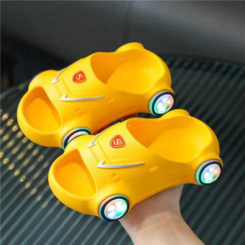 Children's luminous PVC slippers with cartoon car design and anti-slip textured soles