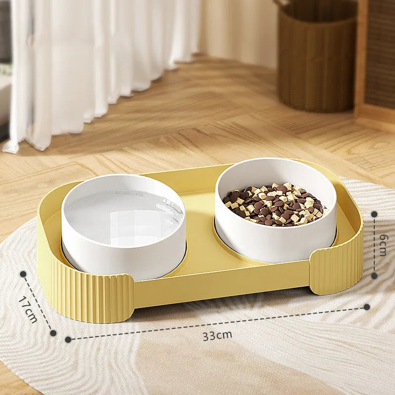 Green elevated ceramic cat bowl set with two bowls on a tilted stand, showing non-slip base.