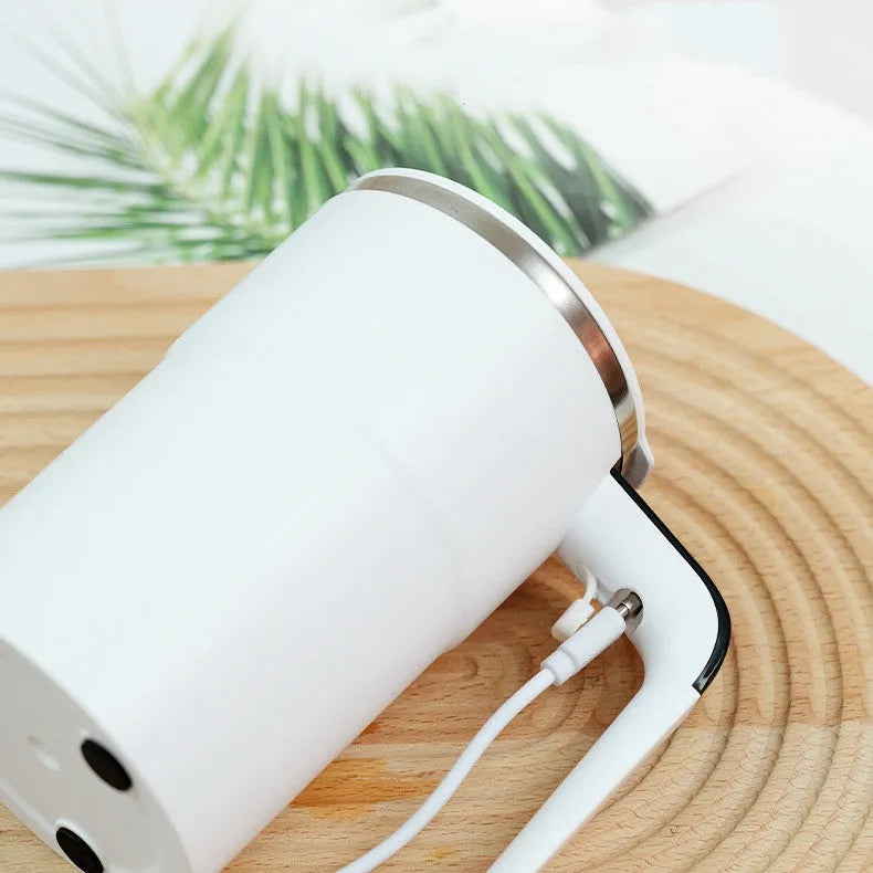 Black electric coffee mug with automatic magnetic stirring and LCD temperature display