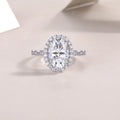Egg-shaped moissanite wedding ring set in S925 silver with platinum plating, 8x12mm stone, sizes 5-9