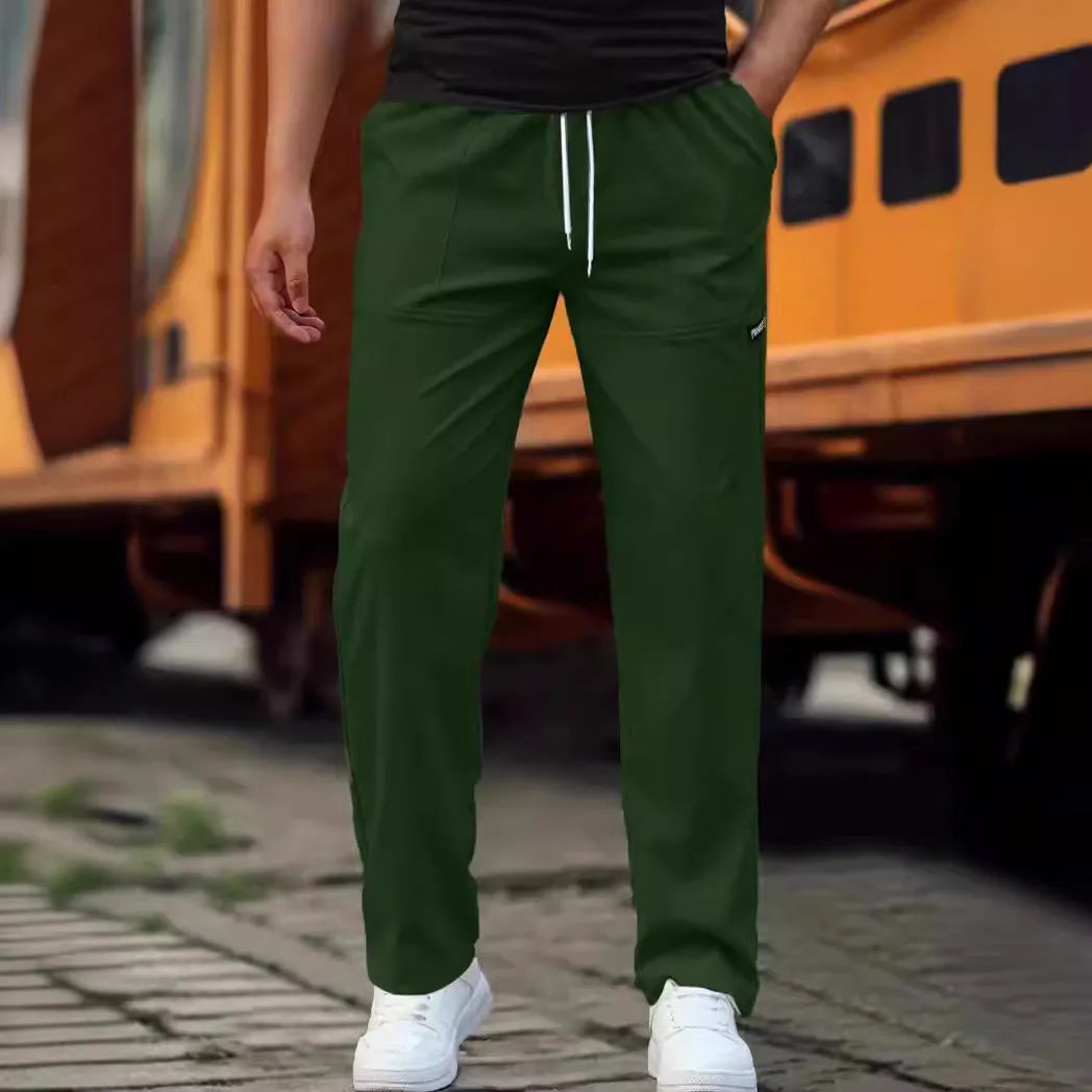 Men's straight-leg polyester trousers in light grey on a hanger