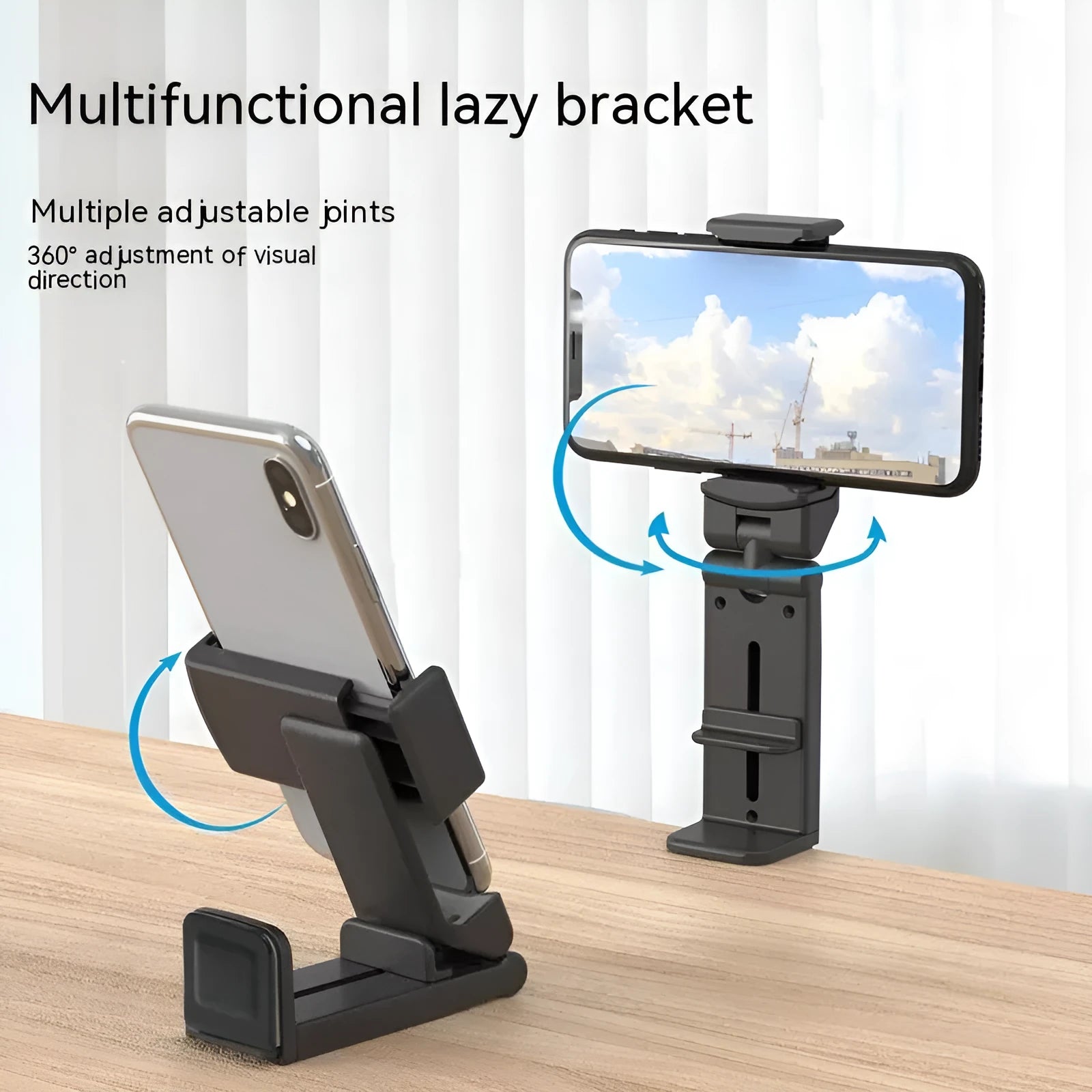 H22 Black colour 360-degree rotating collapsible mobile phone desktop holder on a wooden table.