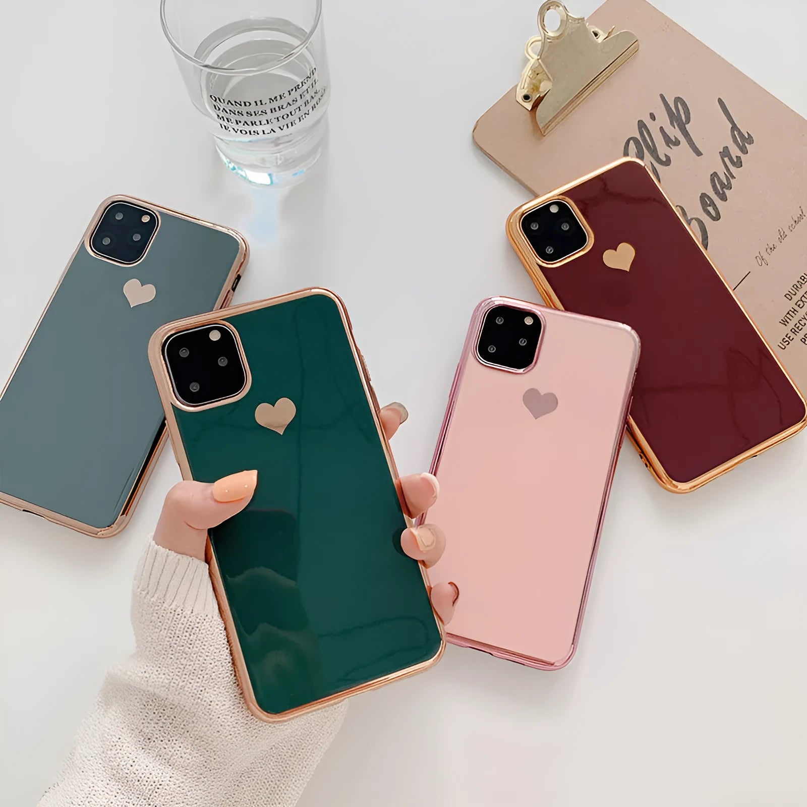Simple solid-colour TPU back cover case for iPhone on a table, showing blue colour option.