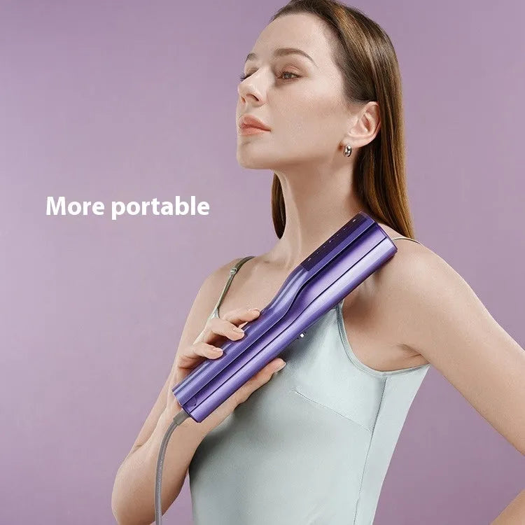Handheld garment steamer with plastic housing showing steam control buttons and UK plug