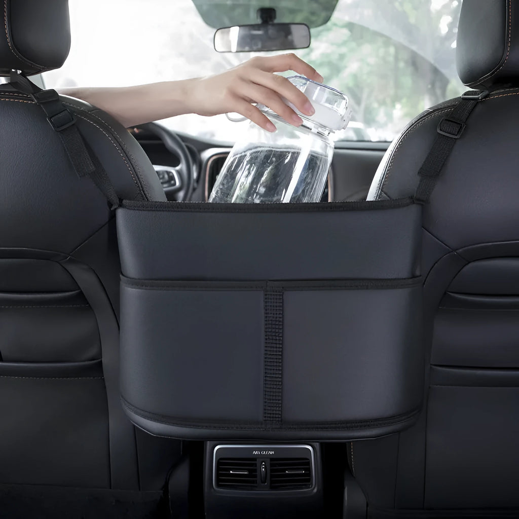 Black leather car seat storage bag with sports carbon fibre pattern, shown on a car seat.
