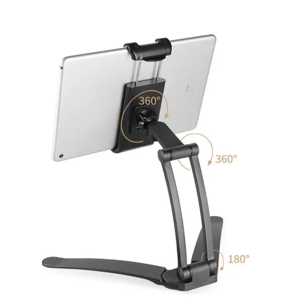 Silver aluminium alloy tablet stand holding a tablet, showing the adjustable clamps and 360-degree rotating hinge.