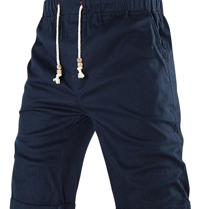 Men's straight-fit casual shorts in blue with a drawstring waistband and a zippered side pocket.