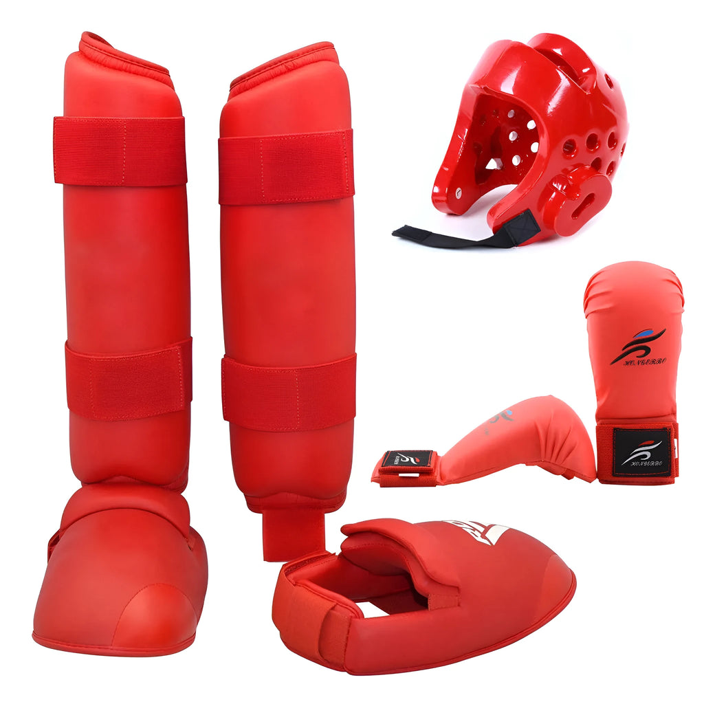 Red and blue karate protective gear set with helmet, boxing gloves and leg guards on training mat