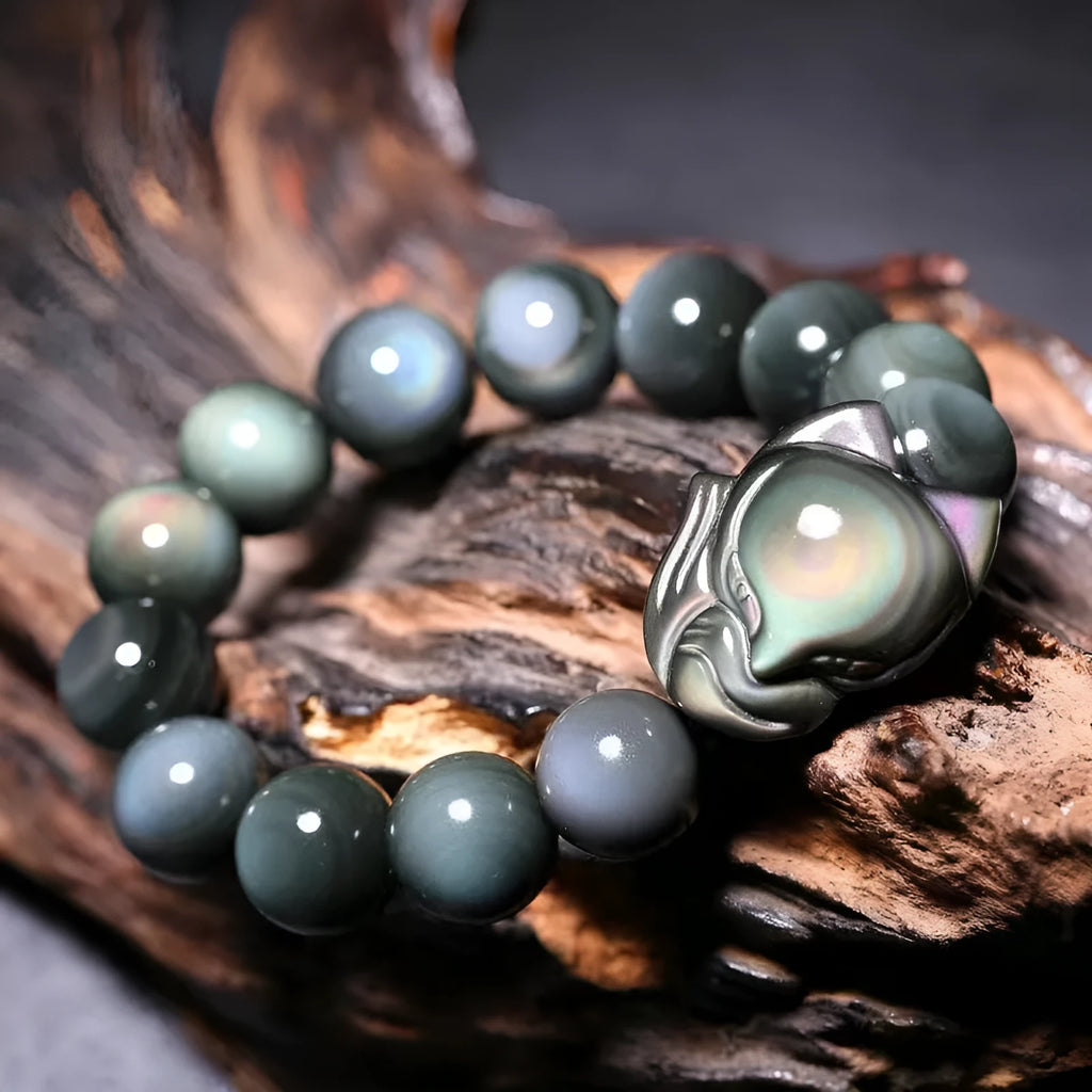 Black obsidian fox carved bracelet showing detailed animal design on polished gemstone