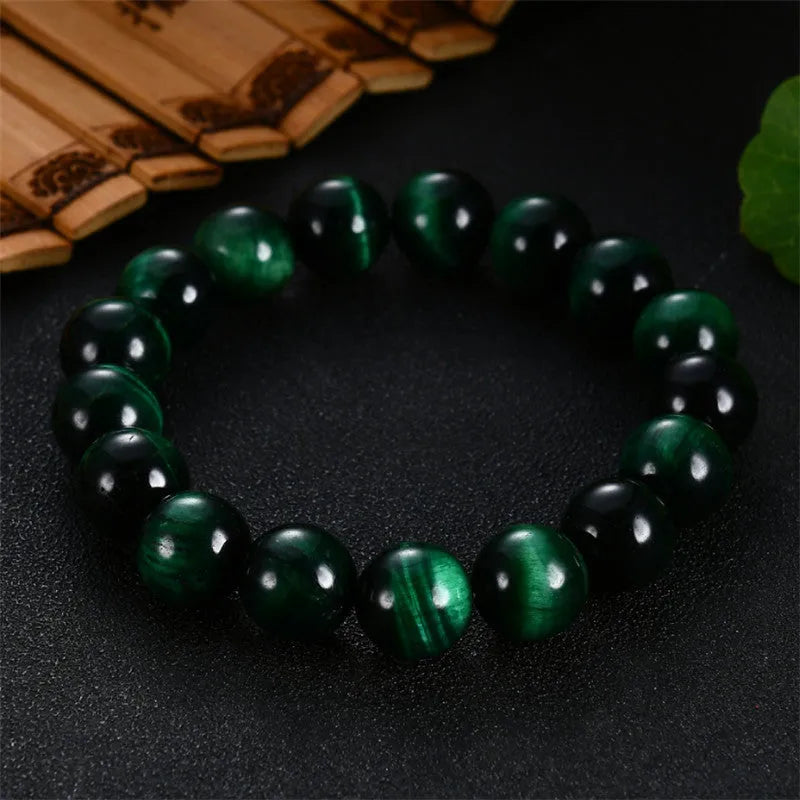 Green Tiger Eye stone bracelet with polished geometric beads in various sizes
