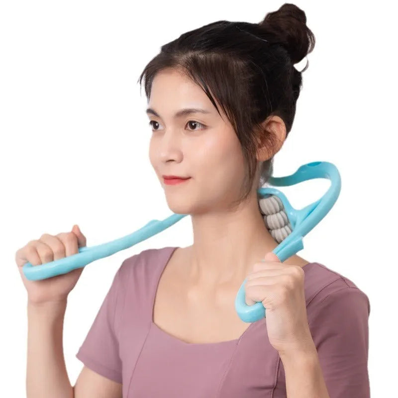 Blue U-shaped electric neck and shoulder massager with six rotating nodes on a table.