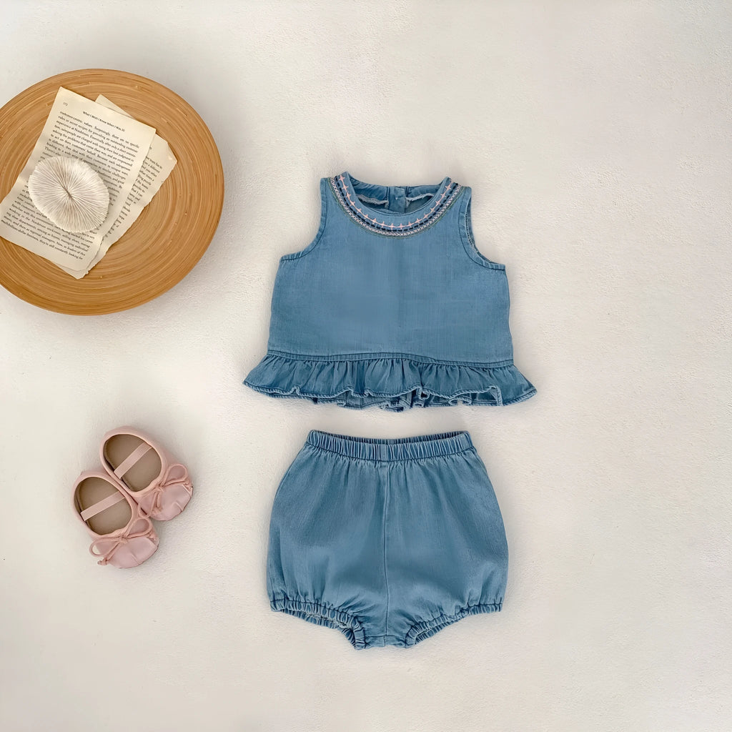 Baby girl denim cotton sleeveless two-piece suit with shorts on a white background