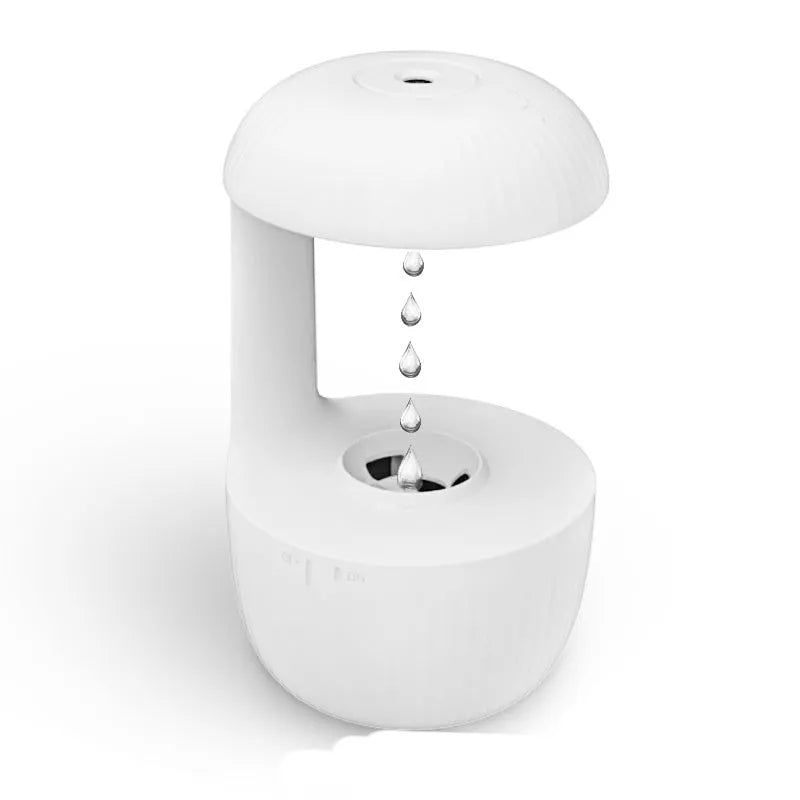 White anti-gravity USB humidifier showing water droplets appearing to flow upward with cool mist output