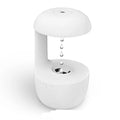 White anti-gravity USB humidifier showing water droplets appearing to flow upward with cool mist output
