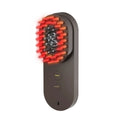 Smart massage comb with red light therapy in black or pink colours, less than 10cm size