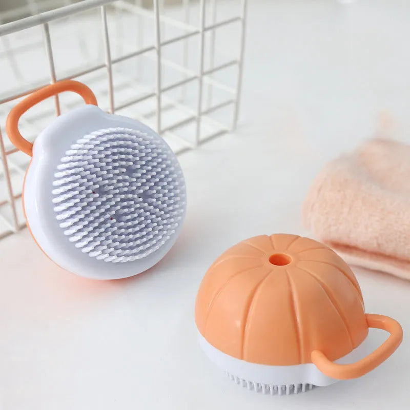 Orange TPR dog bath brush with shampoo dispenser and curved pumpkin grip design
