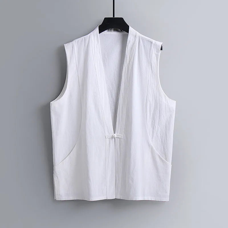 Man modelling a solid grey linen sleeveless vest with a loose fit.
