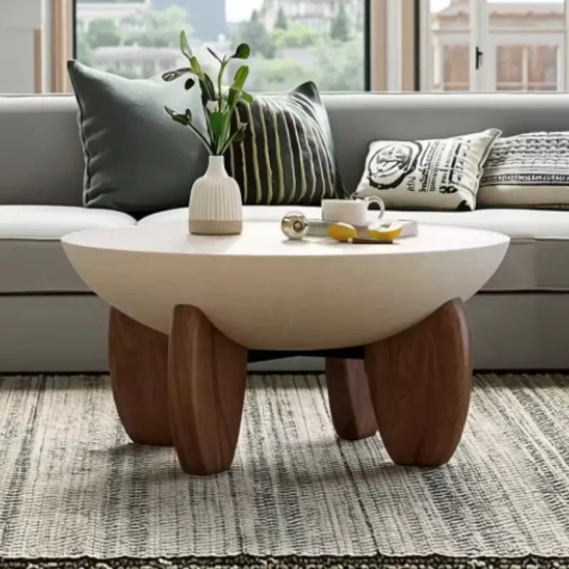 A white solid wood coffee table with adjustable legs and hidden storage compartments.