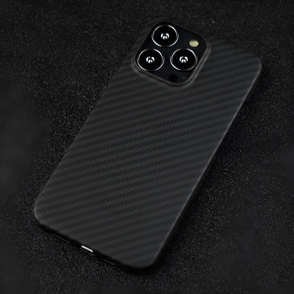 Matte black Kevlar fibre protective iPhone case showing textured surface and precise camera cutouts