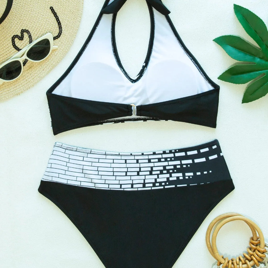 Women's two-piece swimsuit with halter high chest top, briefs-style bottoms, and matching shorts in contrast colour