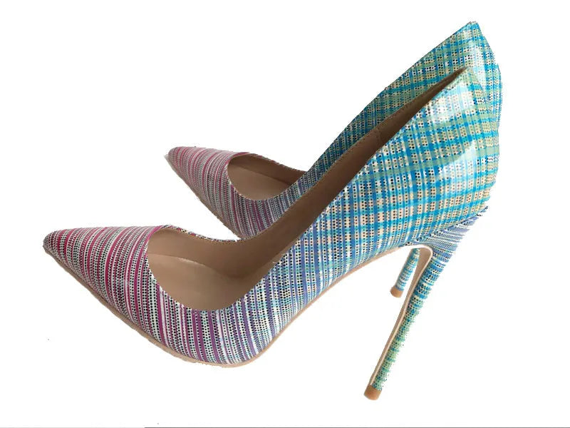 Ladies pink-blue gradient patent leather pointed toe stiletto heels with a tall thin heel on a rubber sole.